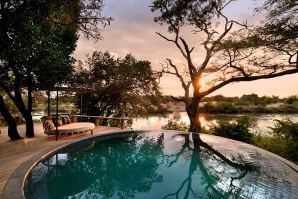 Premium Lodge - TravelLife - Tanzania Grumeti Serengeti River Lodge Guest Areas pool and loungers